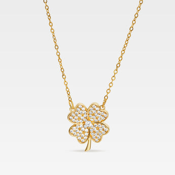 Guldpläterat halsband med fyrklöver prytt med små cubic zirconia-stenar – symbol för tur och hopp.