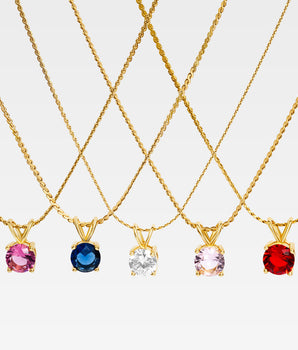 Guldpläterat halsband i rostfritt stål med rund birthstone-berlock (6x10 mm) på 45 cm kedja.