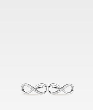 Ett par stiftörhängen formade som infinitysymboler i 925 sterling silver med infattade zirkoniastenar.